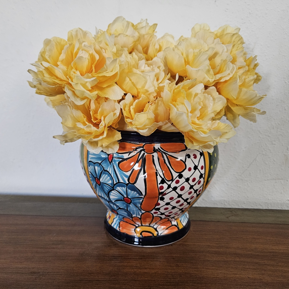 Vibrant Talavera Pottery with Yellow Floral  Arrangement